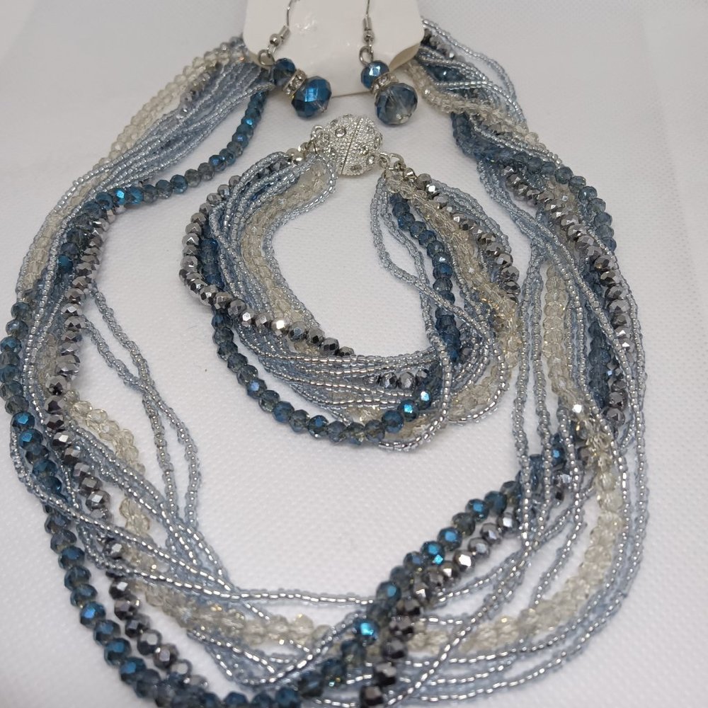 A 9 strand crystal bead 3 piece set including a necklace, bracelet and earrings.